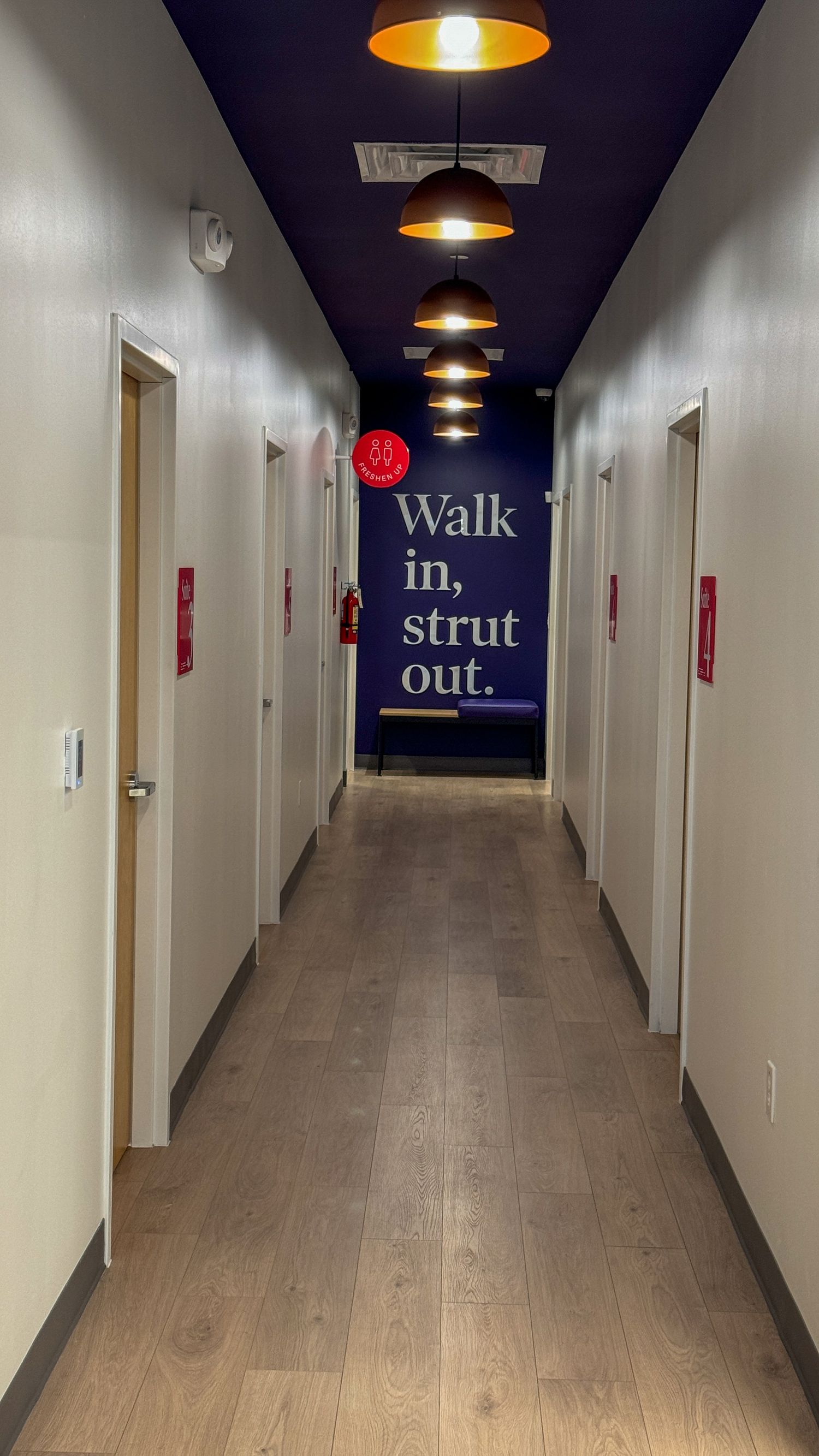 A center hallway with the words Walk in, strut out.