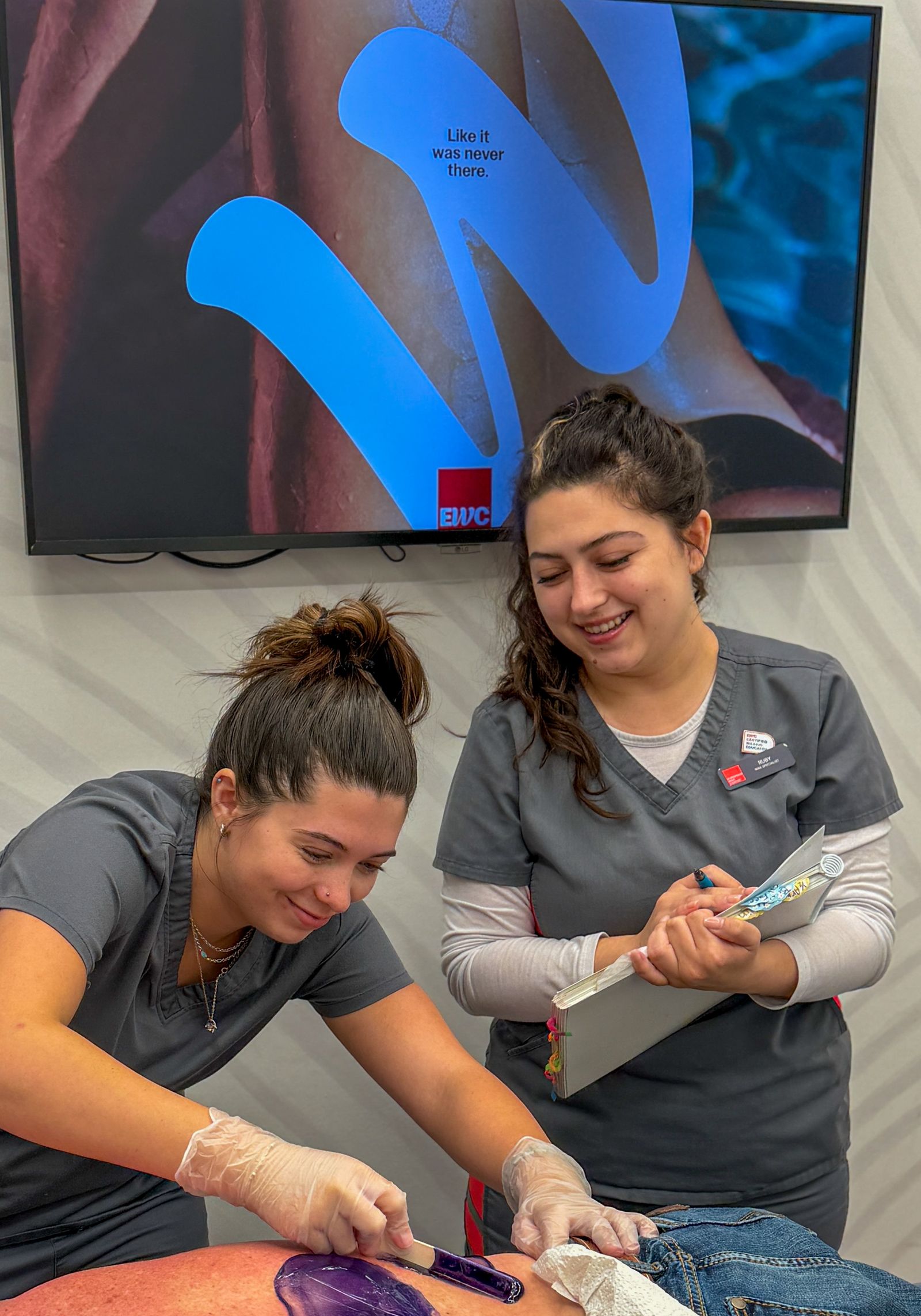 Ruby, a Peer Trainer, coaching a specialist through a service